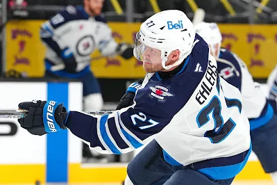 Winnipeg Jets left wing Nikolaj Ehlers warms up before 2025 game.