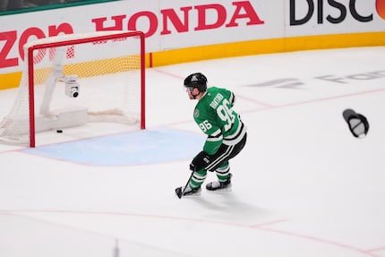 A hat is thrown onto the ice as Dallas Stars' Mikko Rantanen (96) scores an empty-net goal...