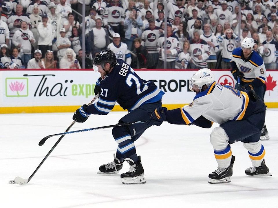  Nikolaj Ehlers the Jets eludes Nick Leddy of the Blues during overtime in Game 7 of first-round playoff series May 4.