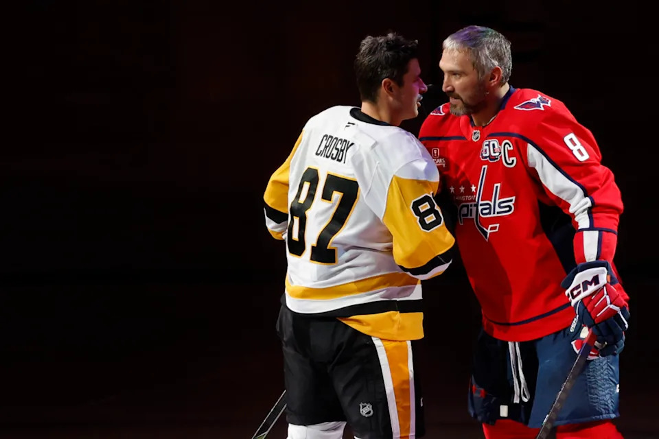 Pittsburgh Penguins center Sidney Crosby (87) and Washington Capitals left wing Alex Ovechkin (8) shake hands after a puck drop.Geoff Burke-Imagn Images