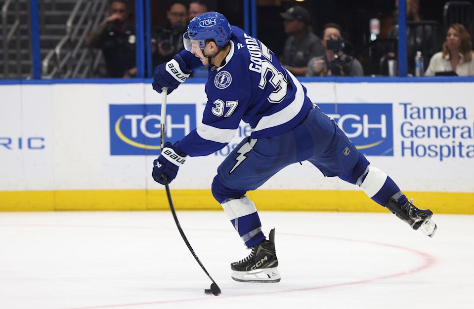 Apr 9, 2025; Tampa, Florida, USA; Tampa Bay Lightning center Yanni Gourde (37) passes the puck against the Toronto Maple Leafs during the second period at Amalie Arena. Mandatory Credit: Kim Klement Neitzel-Imagn Images