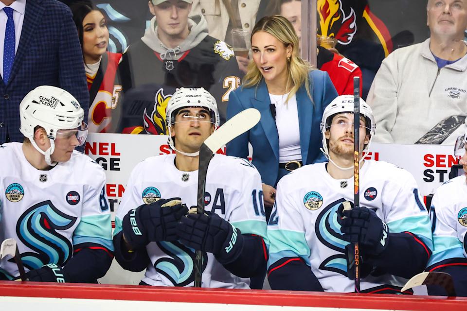 Seattle Kraken assistant coach Jessica Campbell behind the bench during the first period against the Calgary Flames at Scotiabank Saddledome.Sergei Belski-Imagn Images