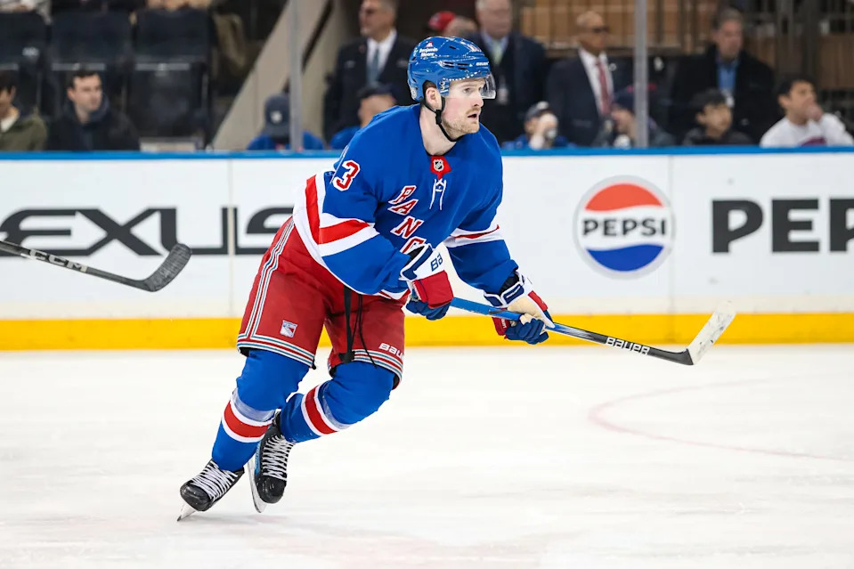 Mar 22, 2025; New York, New York, USA; New York Rangers left wing Alexis Lafreniere (13) skates against the Vancouver Canucks during the third period at Madison Square Garden.