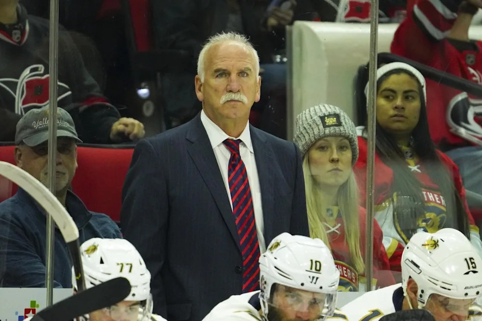 Joel Quenneville stands on bench during Panthers game.James Guillory-Imagn Images
