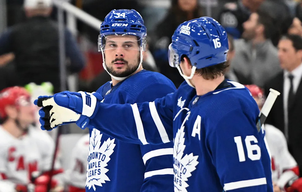 Toronto Maple Leafs forward Mitchell Marner (16) gestures as he speaks with forward Auston Matthews (34).Dan Hamilton-Imagn Images