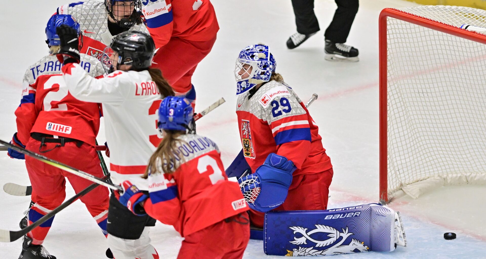 Czech Republic goalkeeper Klara Peslarova, right, fails to save a goal during the IIHF Women's World Championship, Group A, match between Czech Republic and Canada, in Ceske Budejovice, Czech Republic, Monday, April 14, 2025. (Vaclav Pancer/CTK via AP)
