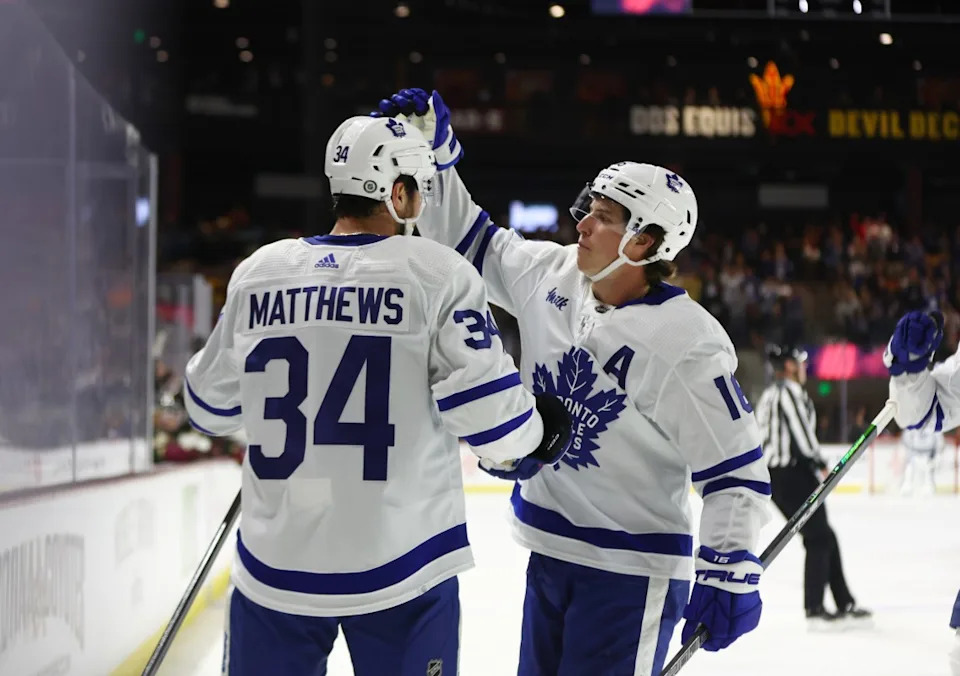 Toronto Maple Leafs center Auston Matthews (34) celebrates with forward Mitch Marner (16) after scoring a goal during the first period against the Arizona Coyotes at Mullett Arena. Mark J&period; Rebilas-USA TODAY Sports