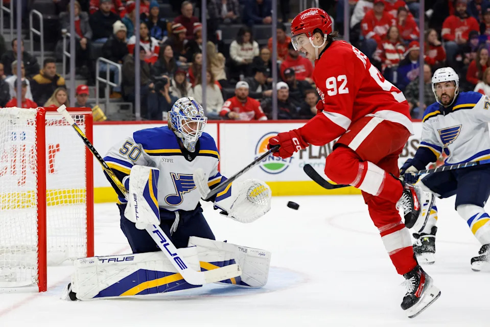 St. Louis Blues goaltender Jordan Binnington (50) makes a save in front of Detroit Red Wings center Marco Kasper (92) in the second period at Little Caesars Arena in Detroit on Monday, Dec. 23, 2024.