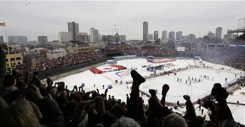 Fans cheer during the national anthem before the NHL Winter Classic hockey game played outside at Wrigley Field. 