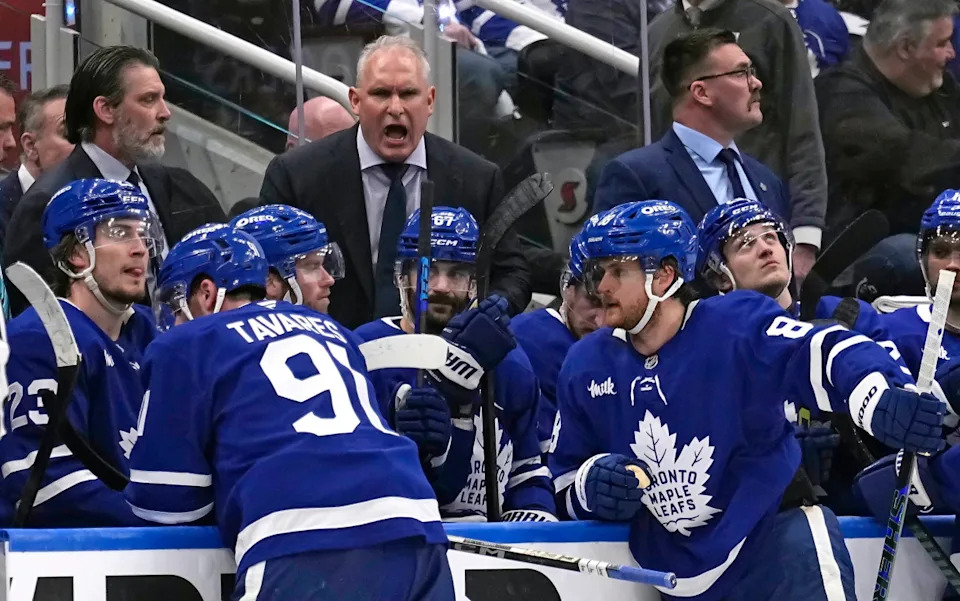 Toronto Maple Leafs head coach Craig Berube (center) talks to his players after a Florida Panthers goal during the third period of Game 1 of the second round of the 2025 Stanley Cup Playoffs at Scotiabank Arena.John E. Sokolowski-Imagn Images