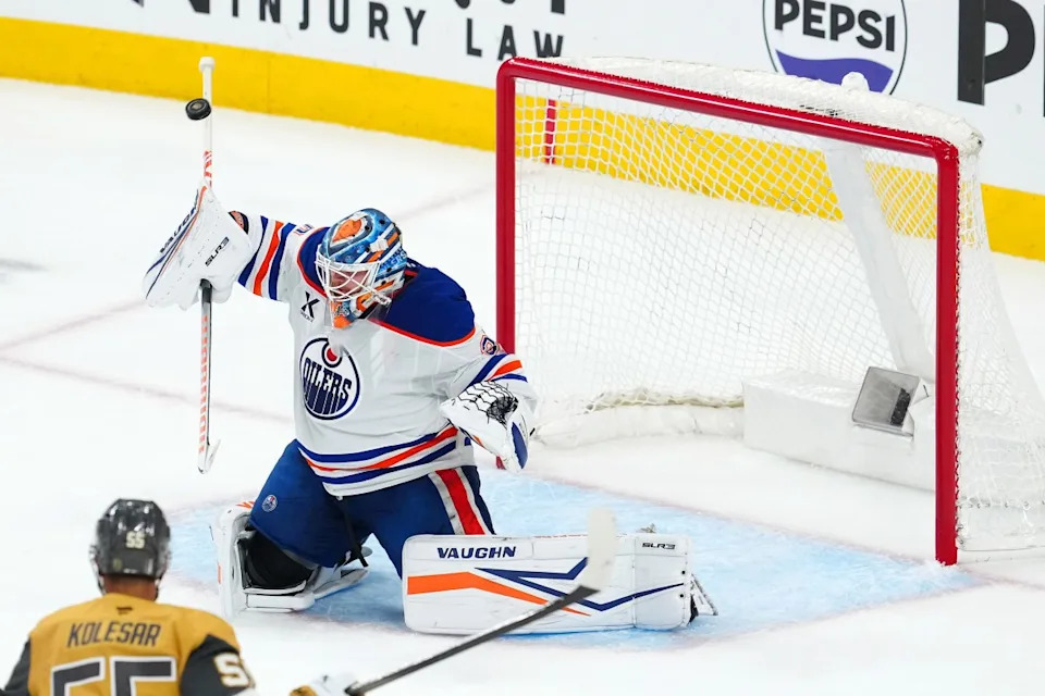 Edmonton Oilers goaltender Calvin Pickard (30) deflects a Vegas Golden Knights shot with his stick during the third period of game two of the second round of the 2025 Stanley Cup Playoffs Stephen R&period; Sylvanie-Imagn Images