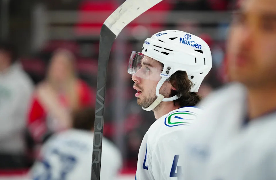 Vancouver Canucks defenseman Quinn Hughes (43) looks on during warmups.James Guillory-Imagn Images