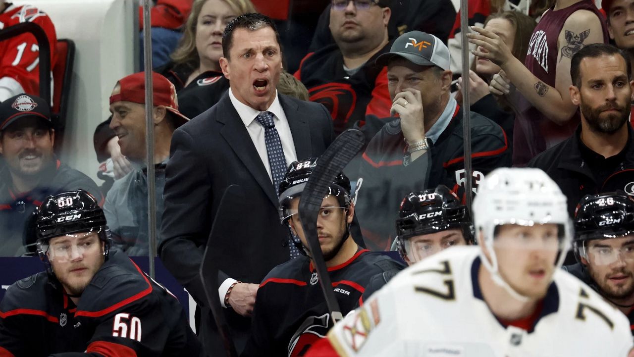 Carolina Hurricanes head coach Rod Brind'Amour watches from the bench during the first period of Game 1 of the NHL hockey Stanley Cup Eastern Conference finals against the Florida Panthers in Raleigh, N.C., Tuesday, May 20, 2025. (AP Photo/Karl DeBlaker)
