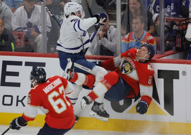 Toronto Maple Leafs defenseman Simon Benoit (2) and Florida Panthers...