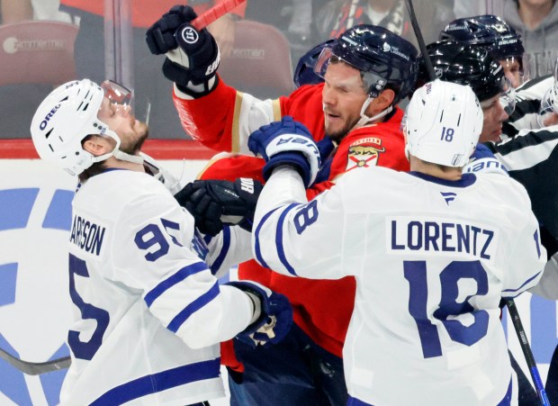 Florida Panthers defenseman Dmitry Kulikov (7) and Toronto Maple Leafs...
