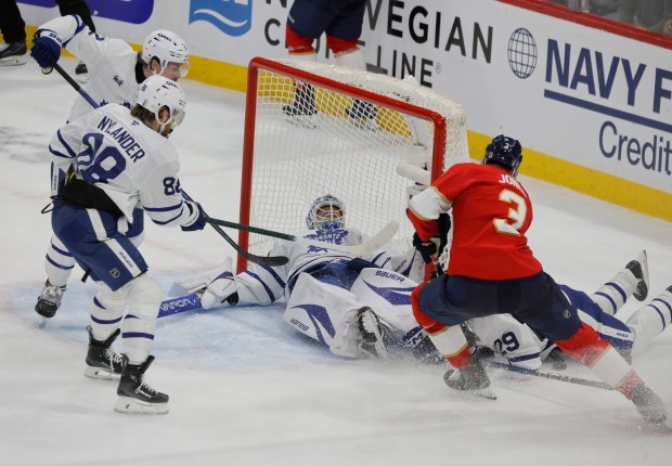 Toronto Maple Leafs goaltender Joseph Woll (60) blocks a shot...