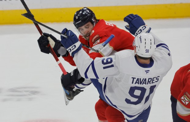 Florida Panthers center Sam Bennett (9) checks Toronto Maple Leafs...