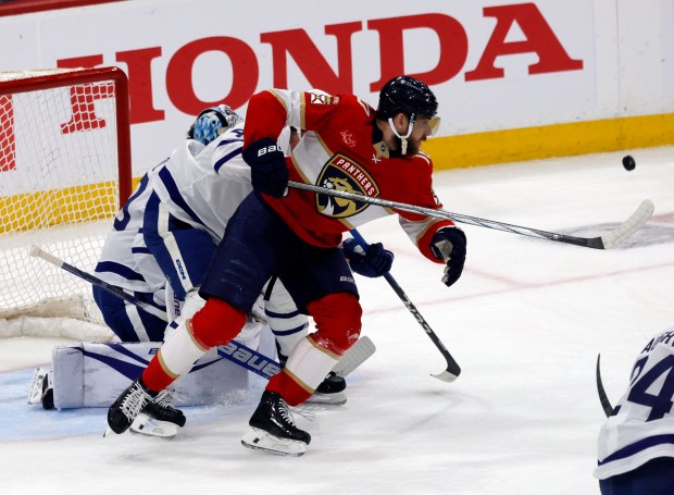 Florida Panthers left wing A.J. Greer (10) tries to center...