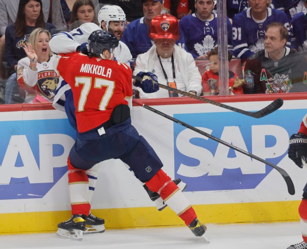 Florida Panthers defenseman Niko Mikkola (77) crashes into Toronto Maple...