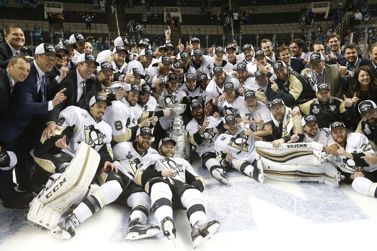 Members of the Pittsburgh Penguins are photographed with the Stanley Cup after their win over the San Jose Sharks in Game 6 of the NHL Stanley Cup Final on Sunday, June 12, 2016 at the SAP Center in San Jose, Calif. (Aric Crabb/Bay Area News Group)