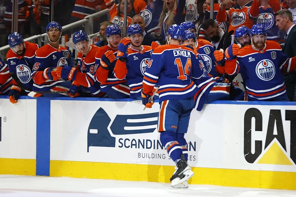Edmonton Oilers defenseman Mattias Ekholm (14) reacts after scoring a goal against the Florida Panthers in the third period in game one of the 2025 Stanley Cup Final at Rogers Place. Perry Nelson-Imagn Images