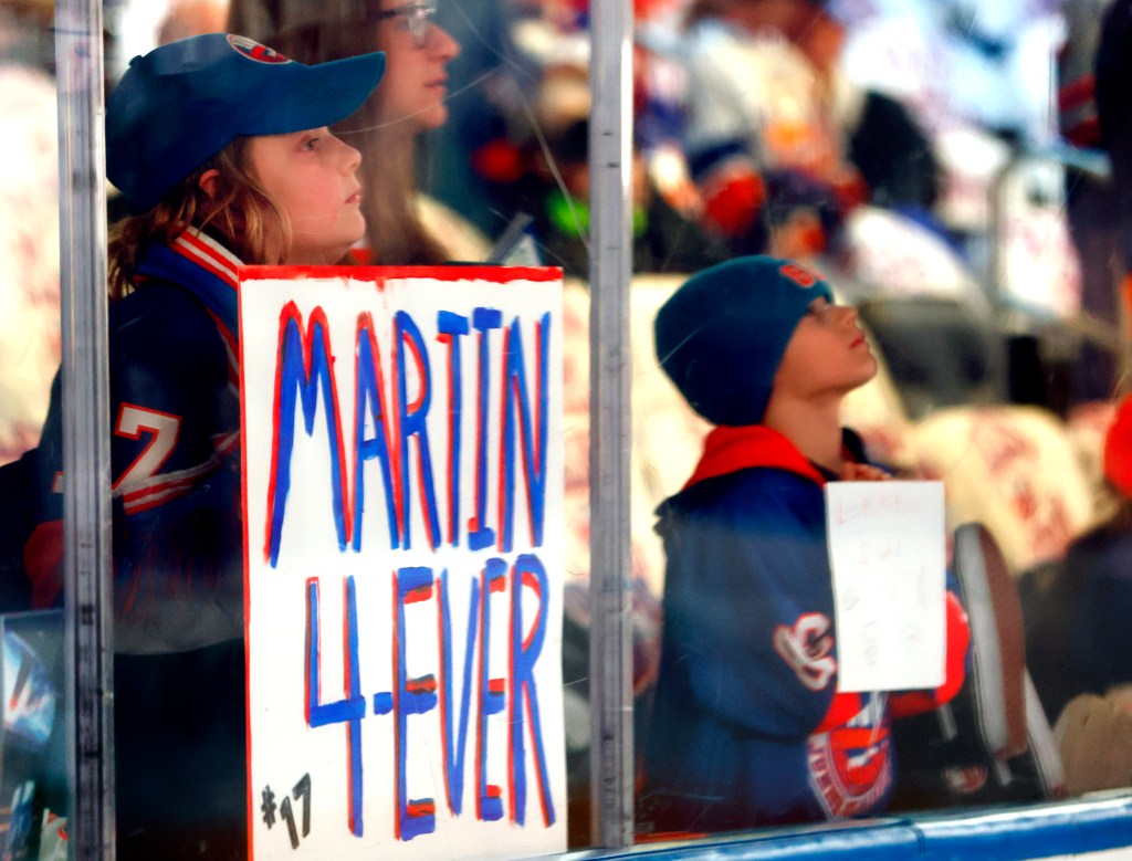 A fan holds a Matt Martin sign during his final Islanders home game on April 15, 2025.