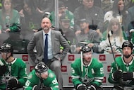 Dallas Stars head coach Pete DeBoer looks up at the scoreboard during the third period of an...