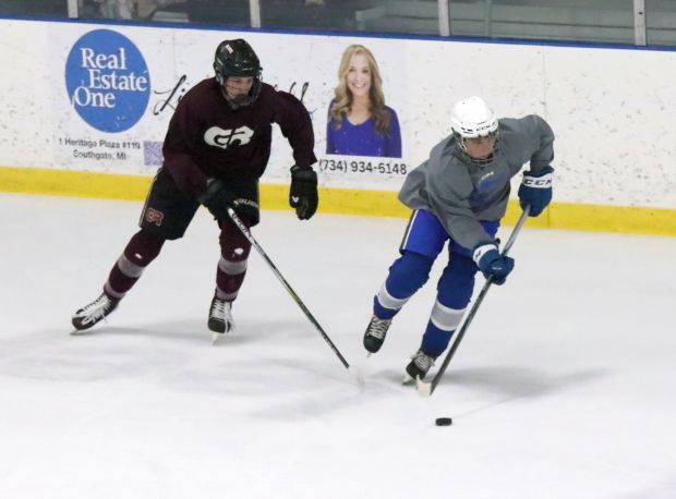 The Gibraltar Carlson ice hockey team, gray, suffered a hard...