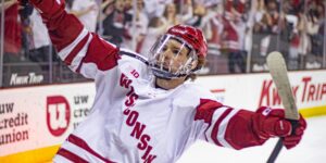 Logan Hensler skating for the University of Wisconsin