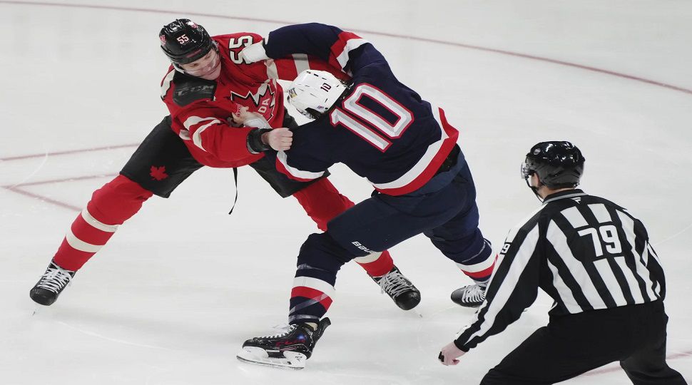 Canada's Colton Parayko (55) fights United States' J.T. Miller (10) during first period 4 Nations Face-Off hockey action in Montreal on Saturday, Feb. 15, 2025. (Christinne Muschi/The Canadian Press via AP)