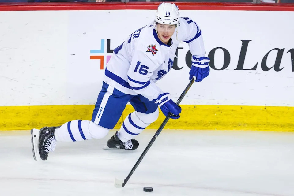 Toronto Maple Leafs right wing Mitchell Marner (16) skates with the puck during the warmup period against the Calgary Flames at Scotiabank Saddledome. Sergei Belski-Imagn Images