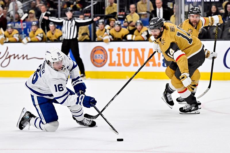  Maple Leafs right winger Mitch Marner takes a shot against Vegas Golden Knights defenceman Nicolas Hague (14) during their game Wednesday, March 5, 2025, in Las Vegas. (AP Photo/David Becker)