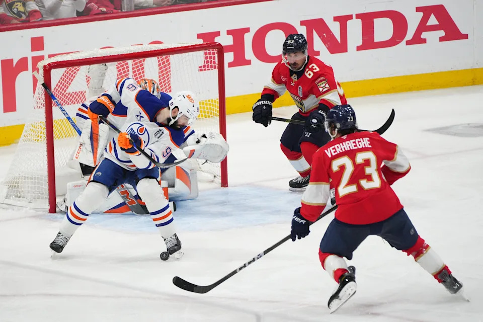 Edmonton Oilers defenseman Jake Walman (96) defends against Florida Panthers forward Carter Verhaeghe (23) during the third period in game three of the 2025 Stanley Cup Final at Amerant Bank Arena in Sunrise, Florida, on June 9, 2025