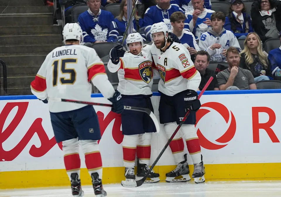 Florida Panthers center Brad Marchand (63) scores a goal and celebrates with defenseman Aaron Ekblad (5) against the Toronto Maple Leafs during the second period in game two of the second round of the...Nick Turchiaro-Imagn Images
