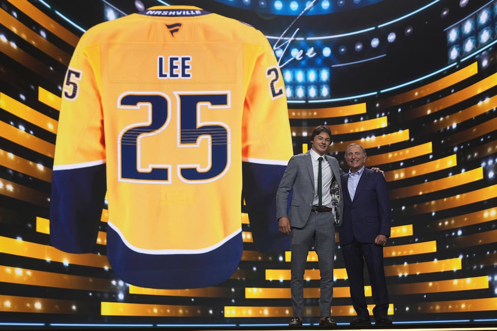 Ryker Lee, left, stands with NHL commissioner Gary Bettman after being drafted by the...