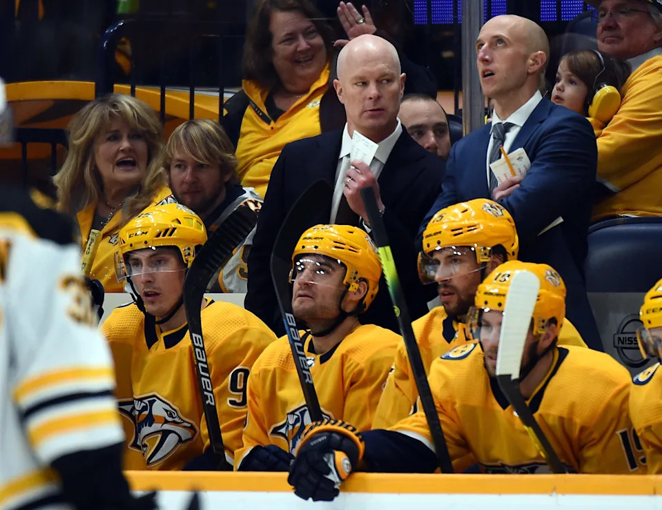 Nashville Predators head coach John Hynes talks with assistant coach Dan Muse, right, during the first period against the Boston Bruins at Bridgestone Arena on Jan. 7, 2020.