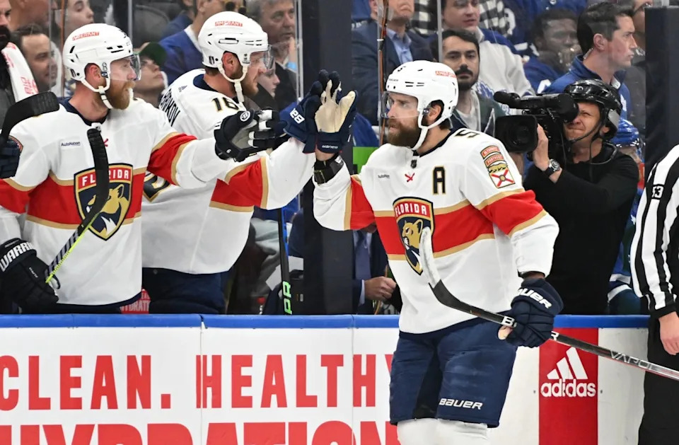 Florida Panthers defenseman Aaron Ekblad (5) celebrates with forwards Aleksander Barkov (16) and Sam Bennett (9) after scoring against the Toronto Maple Leafs in the first period in game five of the s...Dan Hamilton-Imagn Images
