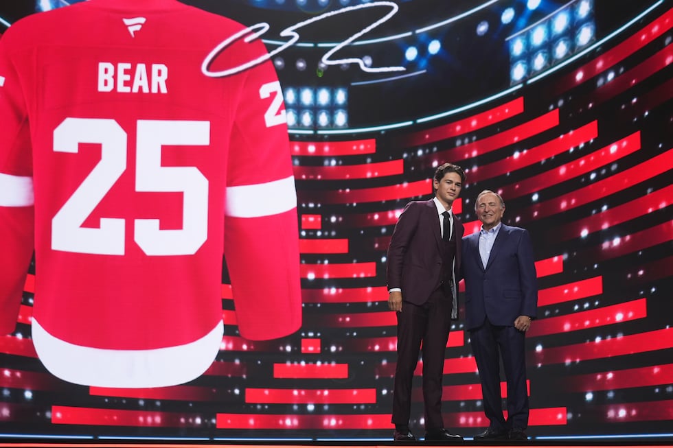 Carter Bear, left, stands with NHL commissioner Gary Bettman after being drafted by Detroit...
