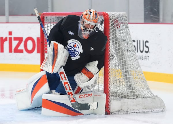 Edmonton Oilers goaltender Stuart Skinner makes a save during practice at the NHL Stanley Cup Finals in Fort Lauderdale, Fla., Tuesday, June 10, 2025.(Nathan Denette/The Canadian Press via AP)