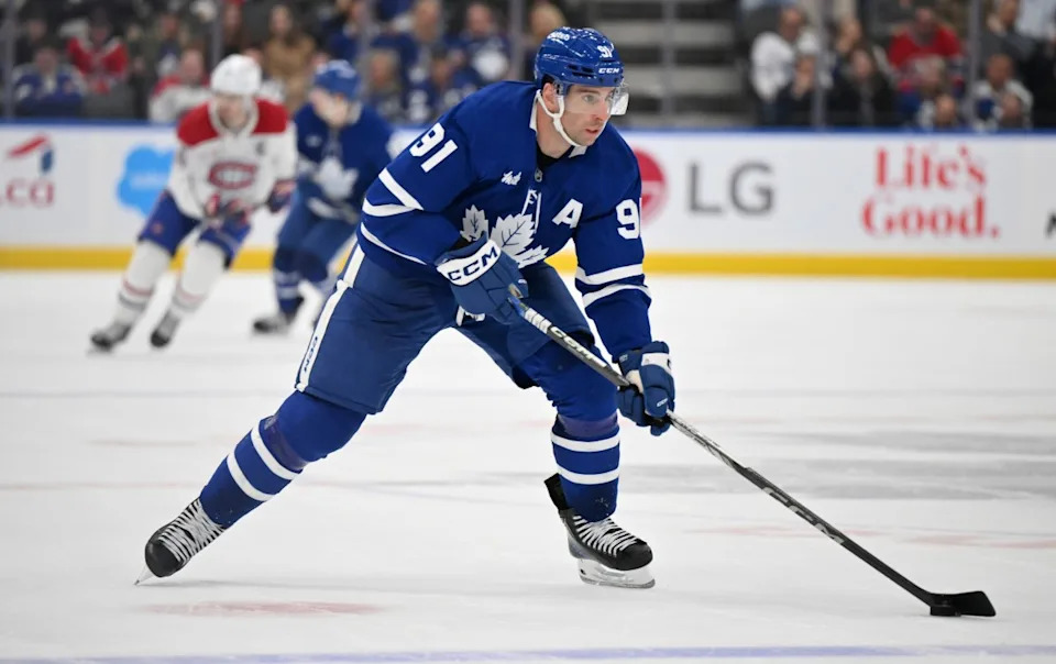 Toronto Maple Leafs forward John Tavares (91) skates with the puck against the Montreal Canadiens in the third period at Scotiabank Arena. Dan Hamilton-Imagn Images