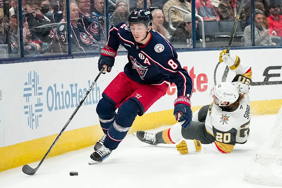 Columbus Blue Jackets defenseman Zach Werenski (8) skates past Vegas Golden Knights left wing Brandon Saad (20) during the second period of the NHL hockey game at Nationwide Arena in Columbus on March 13, 2025.