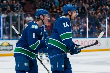 Vancouver Canucks forwards Brock Boeser and Pius Suter.
