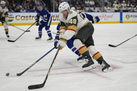 Vegas Golden Knights forward Ivan Barbashev carrying the puck in the offensive zone against the Toronto Maple Leafs.