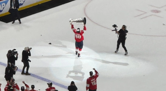 Florida Panthers Defenseman Nate Schmidt hoisting the Stanley Cup after defeating the Edmonton Oilers Florida Panthers Defenseman Nate Schmidt hoisting the Stanley Cup after defeating the Edmonton Oilers