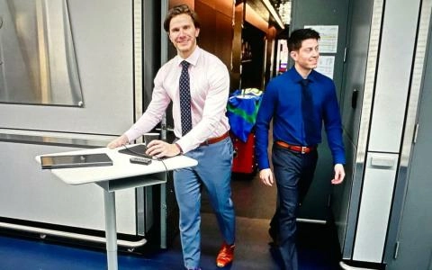 Former Vancouver Canucks video coach Dylan Crawford (right).