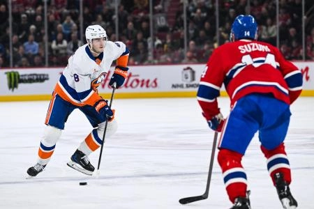 Dec 3, 2024; Montreal, Quebec, CAN; New York Islanders defenseman Noah Dobson (8) plays the puck against Montreal Canadiens center Nick Suzuki (14) during the second period at Bell Centre. Mandatory Credit: David Kirouac-Imagn Images Dec 3, 2024; Montreal, Quebec, CAN; New York Islanders defenseman Noah Dobson (8) plays the puck against Montreal Canadiens center Nick Suzuki (14) during the second period at Bell Centre. Mandatory Credit: David Kirouac-Imagn Images