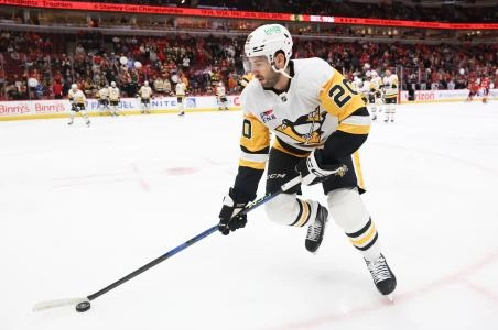 Apr 6, 2025; Chicago, Illinois, USA; Pittsburgh Penguins defenseman Conor Timmins (20) warms up before a game against the Chicago Blackhawks at United Center. Apr 6, 2025; Chicago, Illinois, USA; Pittsburgh Penguins defenseman Conor Timmins (20) warms up before a game against the Chicago Blackhawks at United Center.