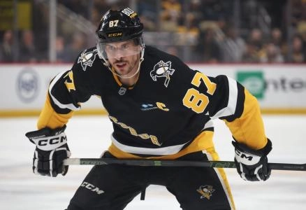 Apr 8, 2025; Pittsburgh, Pennsylvania, USA; Pittsburgh Penguins center Sidney Crosby (87) prepares to take a face-off against the Chicago Blackhawks during the third period at PPG Paints Arena. Mandatory Credit: Charles LeClaire-Imagn Images