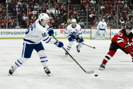 Toronto Maple Leafs forward Mitch Marner attempting a pass against the New Jersey Devils
