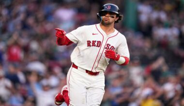 Boston Red Sox's Marcelo Mayer points towards the Red Sox dugout while rounding the bases on his solo home run during the second inning of a baseball game against the Tampa Bay Rays at Fenway Park, Wednesday, June 11, 2025, in Boston. (AP Photo/Charles Krupa)